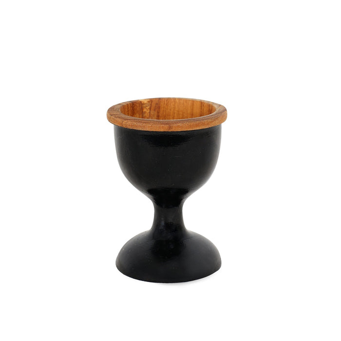 Front view of teak egg cup with black exterior displayed on a white background