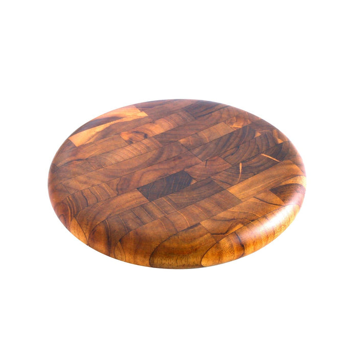 Circular end grain teak cutting board displayed on a white background