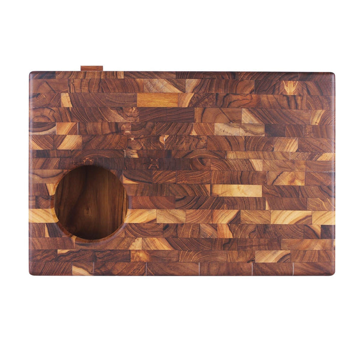Top view of end grain teak chopping board with rubbish drawer and hole displayed on a white background