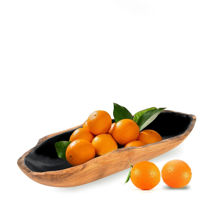 Medium teak bowl with black interior filled with oranges displayed on a white background