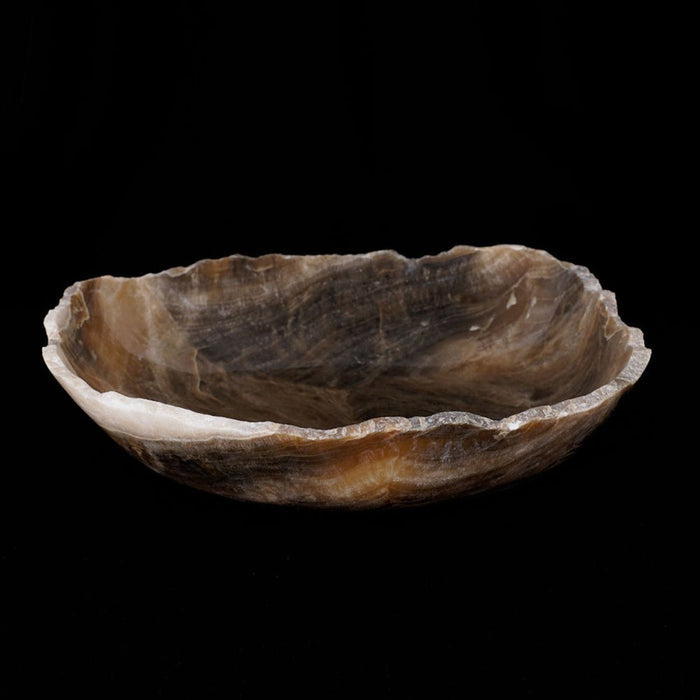 Side view of onyx bowl displayed on a black background