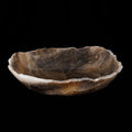 Side view of onyx bowl displayed on a black background