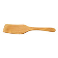 Teak spatula on a white background