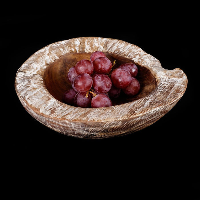 Large whitewash teak bowl filled with grapes displayed on a black background