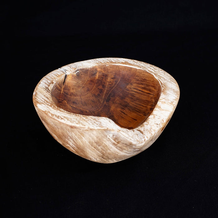 Small teak bowl with a whitewash exterior displayed on a black background
