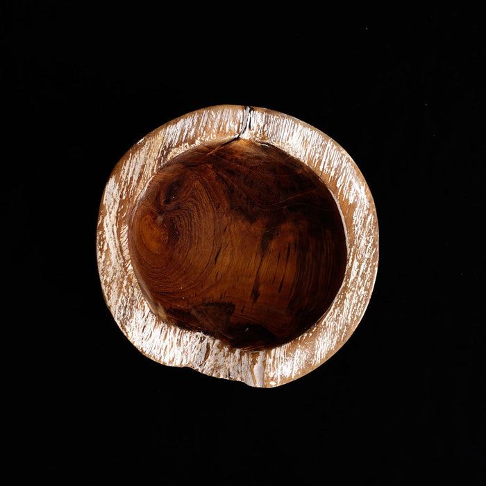 Top view of small teak bowl with whitewash exterior displayed on a black background
