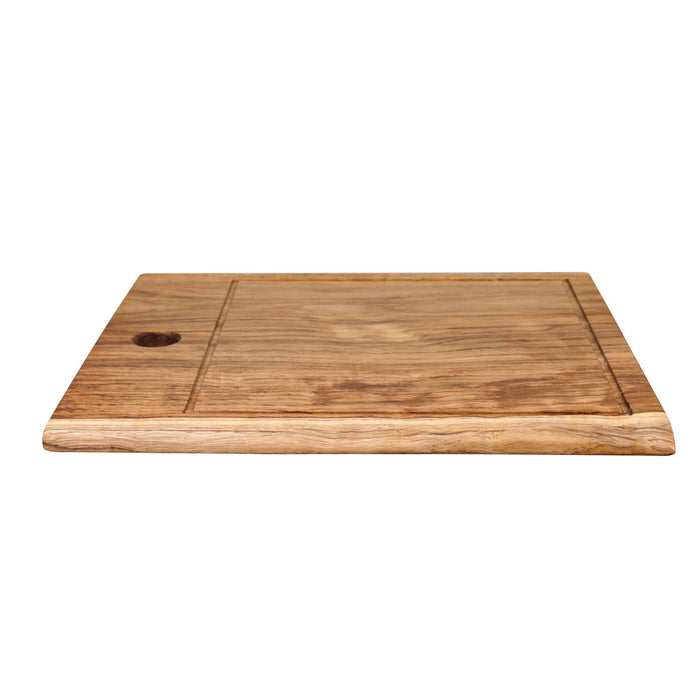 Side view of large teak cutting board displayed on a white background