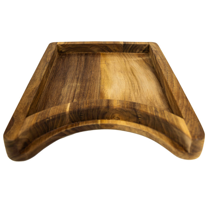 Bottom view of a teak chopping board with the raised platform with a cutout section for a plate on a white background