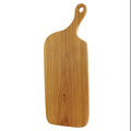 Teak cutting board with natural teak handle displayed vertically displayed on a white background