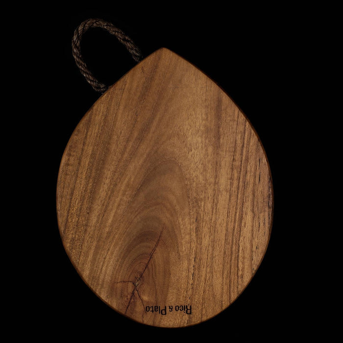 Rico & Plato limone teak cutting board serving platter with a rope handle displayed vertically on a black background