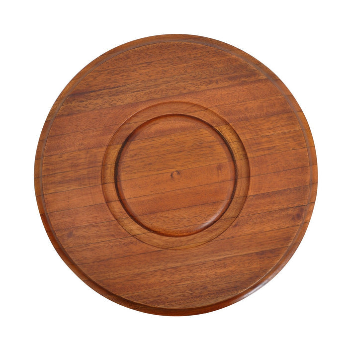 Bottom of a wooden round dog bowl with concentric circle design on a white background