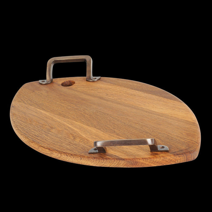 Oak serving platter oval shaped with metal handles displayed on a black background