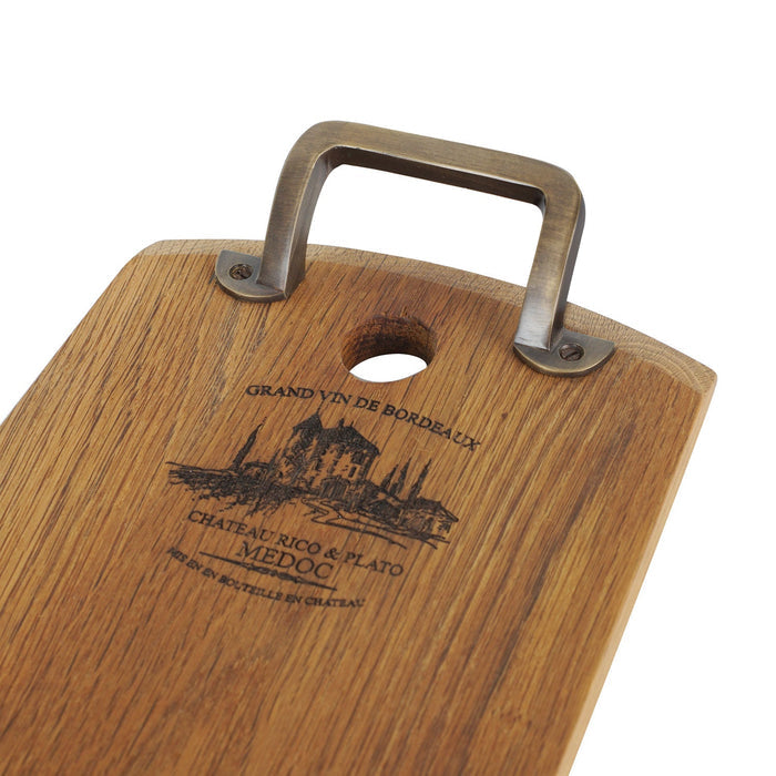 Close up of metal handle of rectangular oak serving platter displayed on a white background