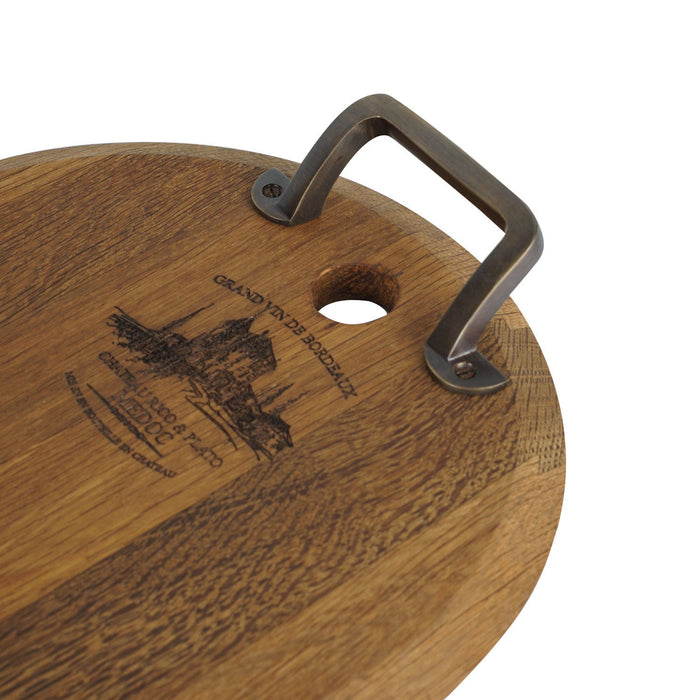 Close up of metal handle of small oak serving platter displayed on a white background