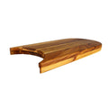 Side view of teak cutting board with a plate cut out displayed on a white background