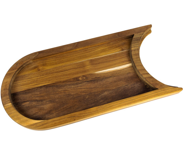 Bottom view of a teak chopping board with the raised platform with a cutout section for a plate on a white background