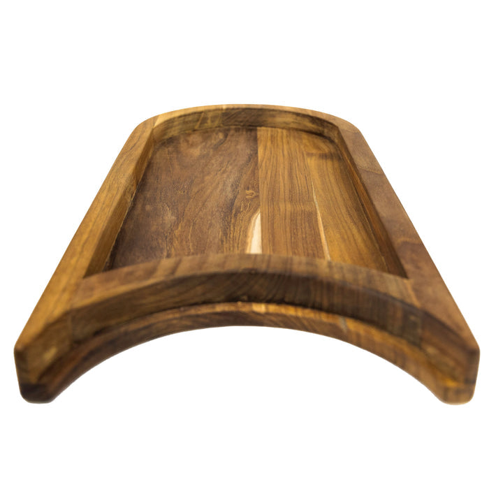 Bottom view of a teak chopping board with the raised platform with a cutout section for a plate on a white background