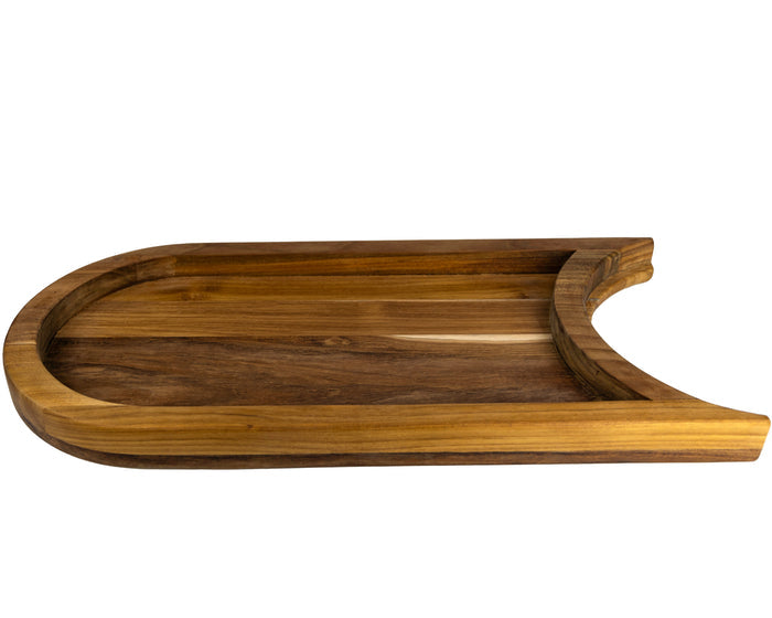 Bottom view of a teak chopping board with the raised platform with a cutout section for a plate on a white background