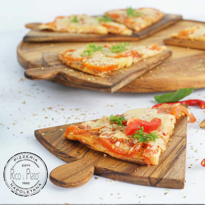 Pizza on Rico & Plato Napoletana 15 inch pizza serving board on a white counter