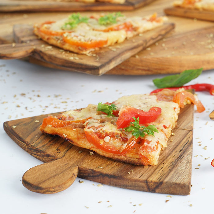 Pizza on Rico & Plato Napoletana 15 inch pizza serving board on a white counter