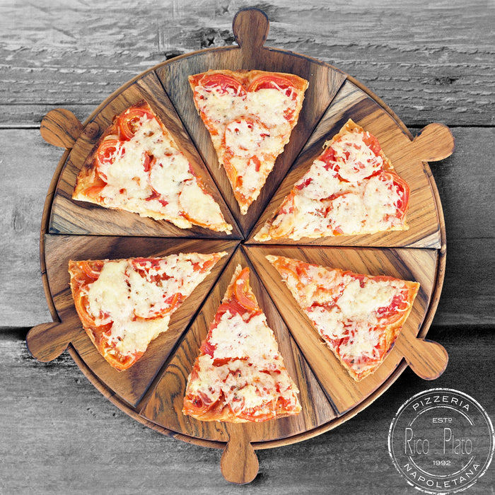 Pizza on a Rico & Plato Napoletana 15 inch pizza serving board on a grey wooden surface