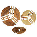 Set of 3 teak trivet with geometric patterns on a white background