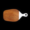 Front view of teak cutting board with white handle displayed horizontally on a black background