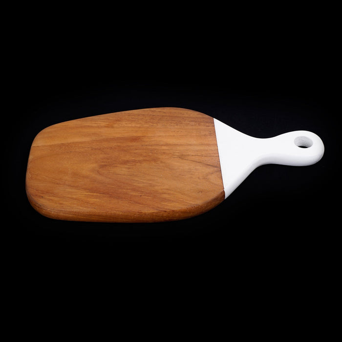 Teak cutting board with white handle displayed on a black background