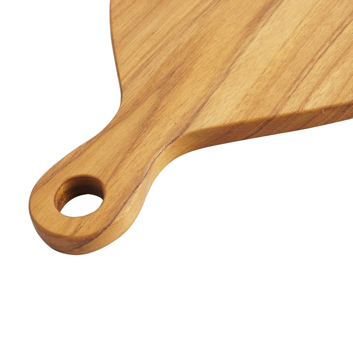Close up of natural teak handle of teak cutting board displayed on a white background