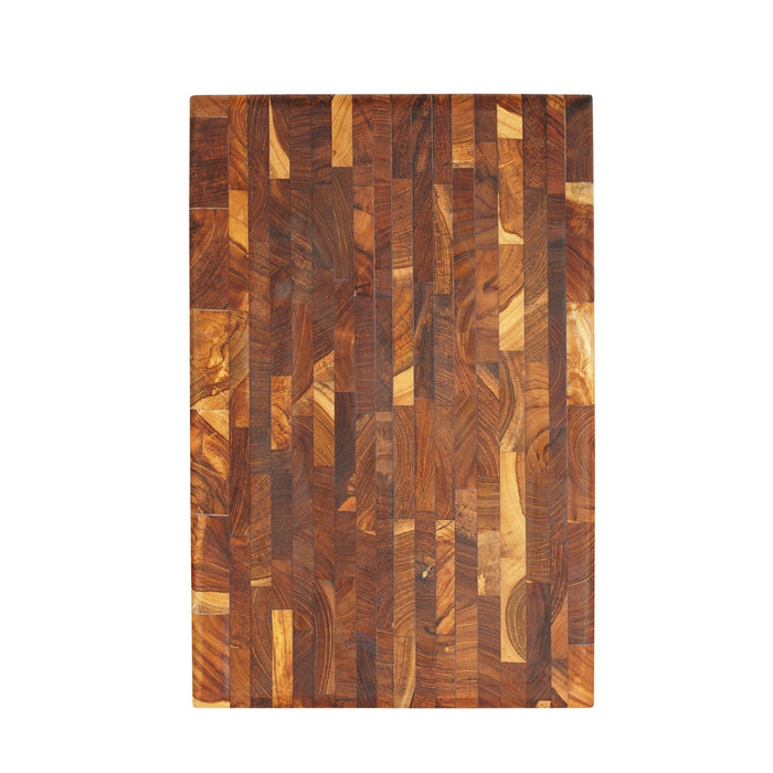 Top view of end grain teak cutting board displayed vertically on a white background