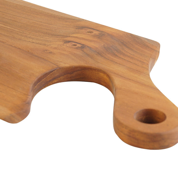 Close up of natural teak handle of teak cutting board displayed on a white background