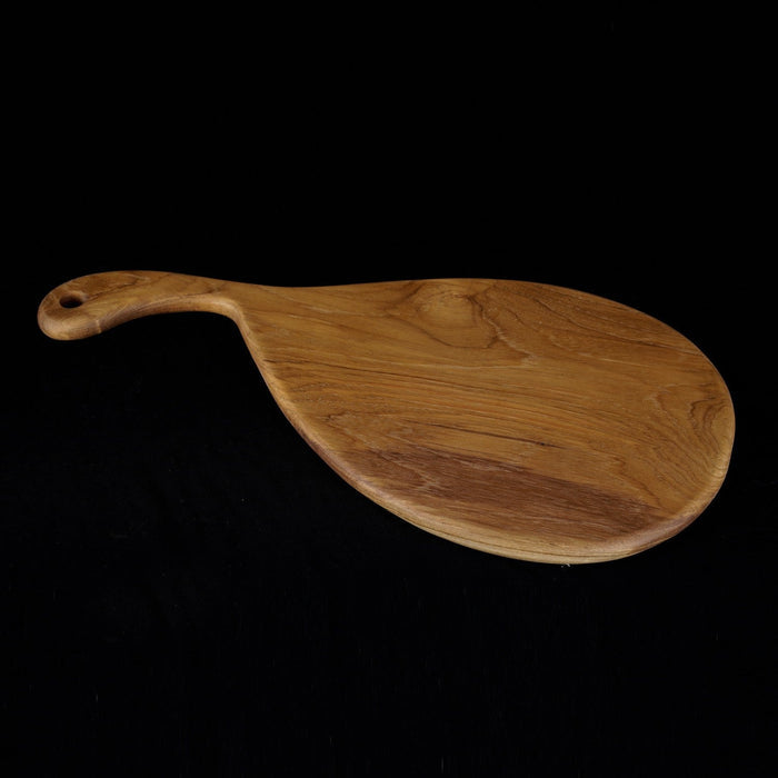 Rico & Plato savory teak cutting board serving platter displayed on a black background