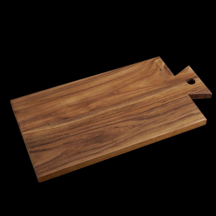 Teak cutting board/serving platter with handle displayed on a black background