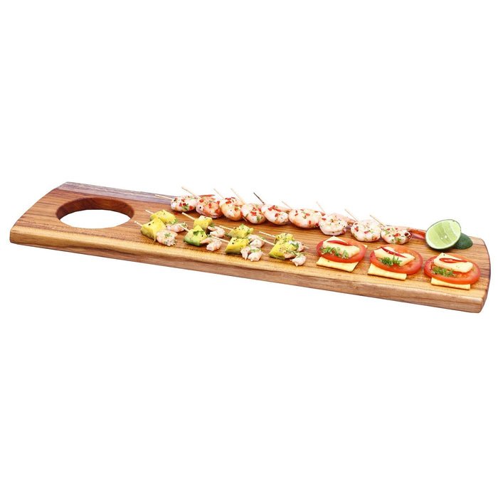 Rico & Plato teak serving board with charcuterie materials placed on board displayed on a white background