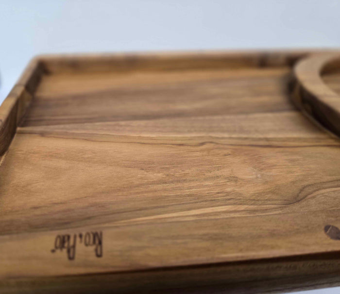 Wooden tray with a lip on a light background