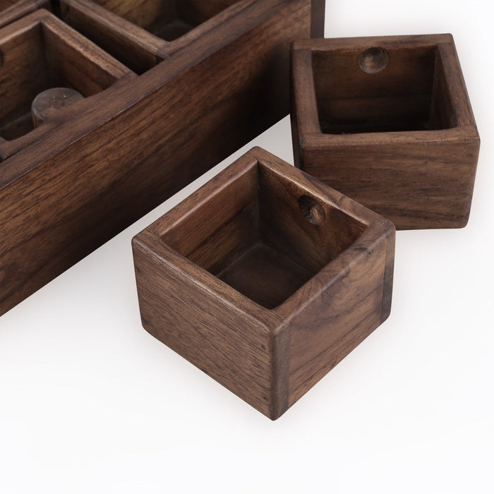 2 of the boxes for the Rico & Plato teak spice box on the side displayed on a white background