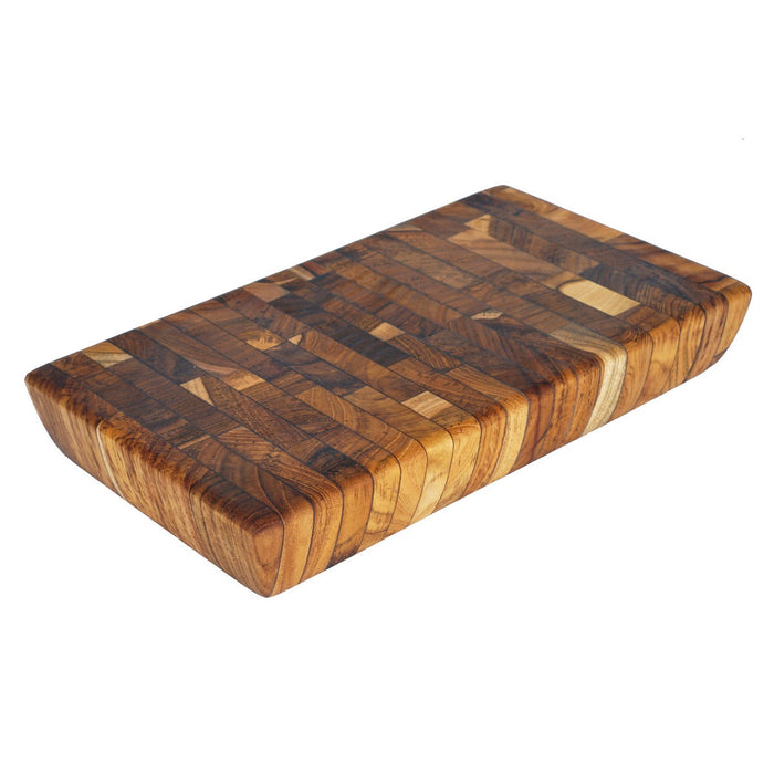 Rectangular end grain teak cutting board displayed on a white background