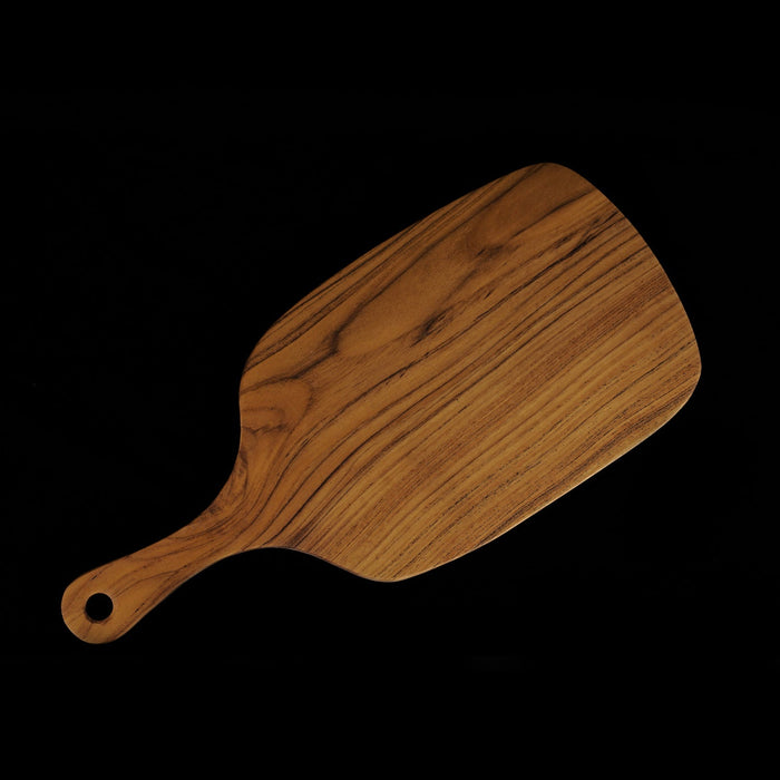 Top view of teak cutting board/serving platter shaped as a paddle with handle displayed on a black background