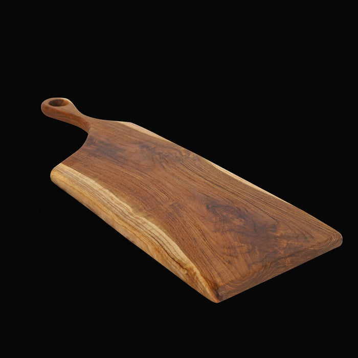 Teak cutting board with handle displayed on a black background