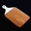 Square teak cutting board/serving platter with white handle displayed on a black background