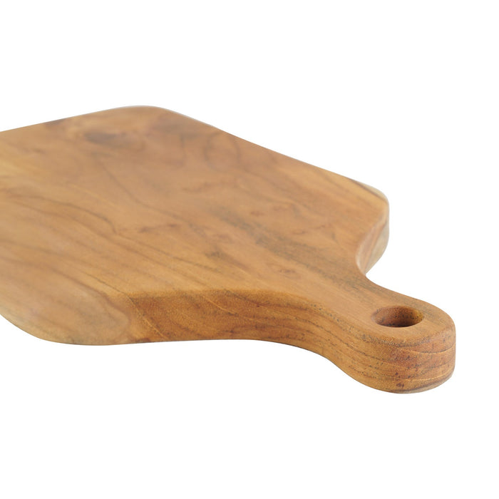 Close up of handle of teak cutting board displayed on a white background