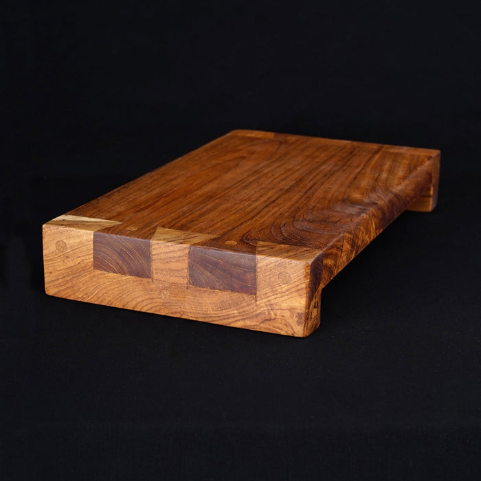 Rico & Plato wasabi teak serving platter displayed on a black surface