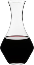 Riedel cabernet decanter with red wine inside on a white background