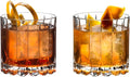 Set of wo Riedel rocks glasses both with brown liquid inside on a white background