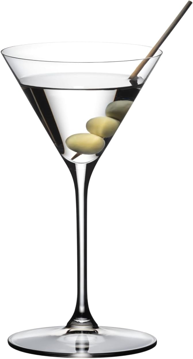Martini glass with olive garnish on a white background