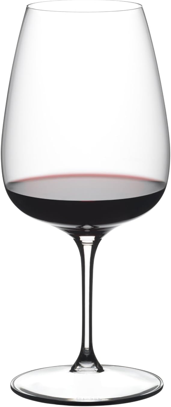 Wine glass filled with red wine on a white background