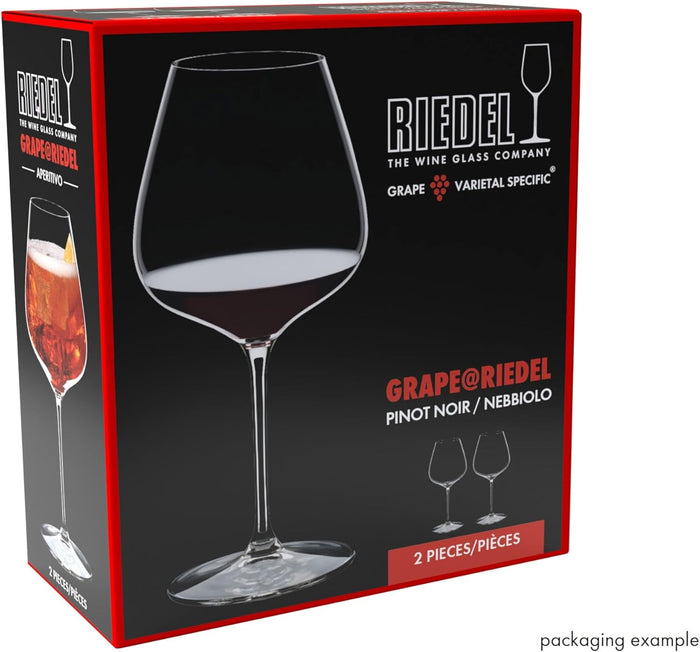 Riedel wine glass packaging with a glass of red wine on a black background