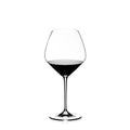 Riedel Pinot noir wine glass with red wine inside on a white background