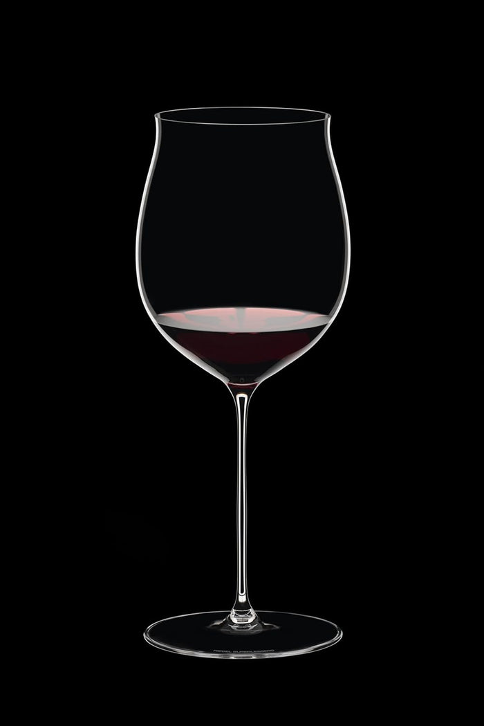 Riedel Superleggero Burgundy Grand glass with red wine inside on a black background
