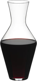 A clear Riedel Veloce decanter filled with red wine, designed to hold a single bottle of wine.